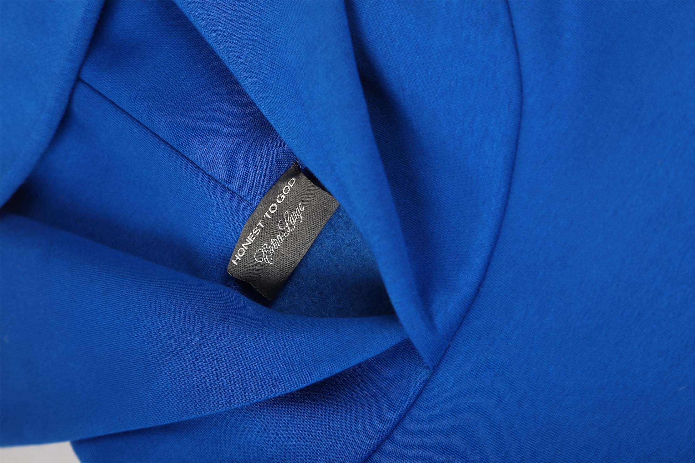 Detail shot of the structured double-layered hood on Honest to God Cobalt Blue hoodie.
