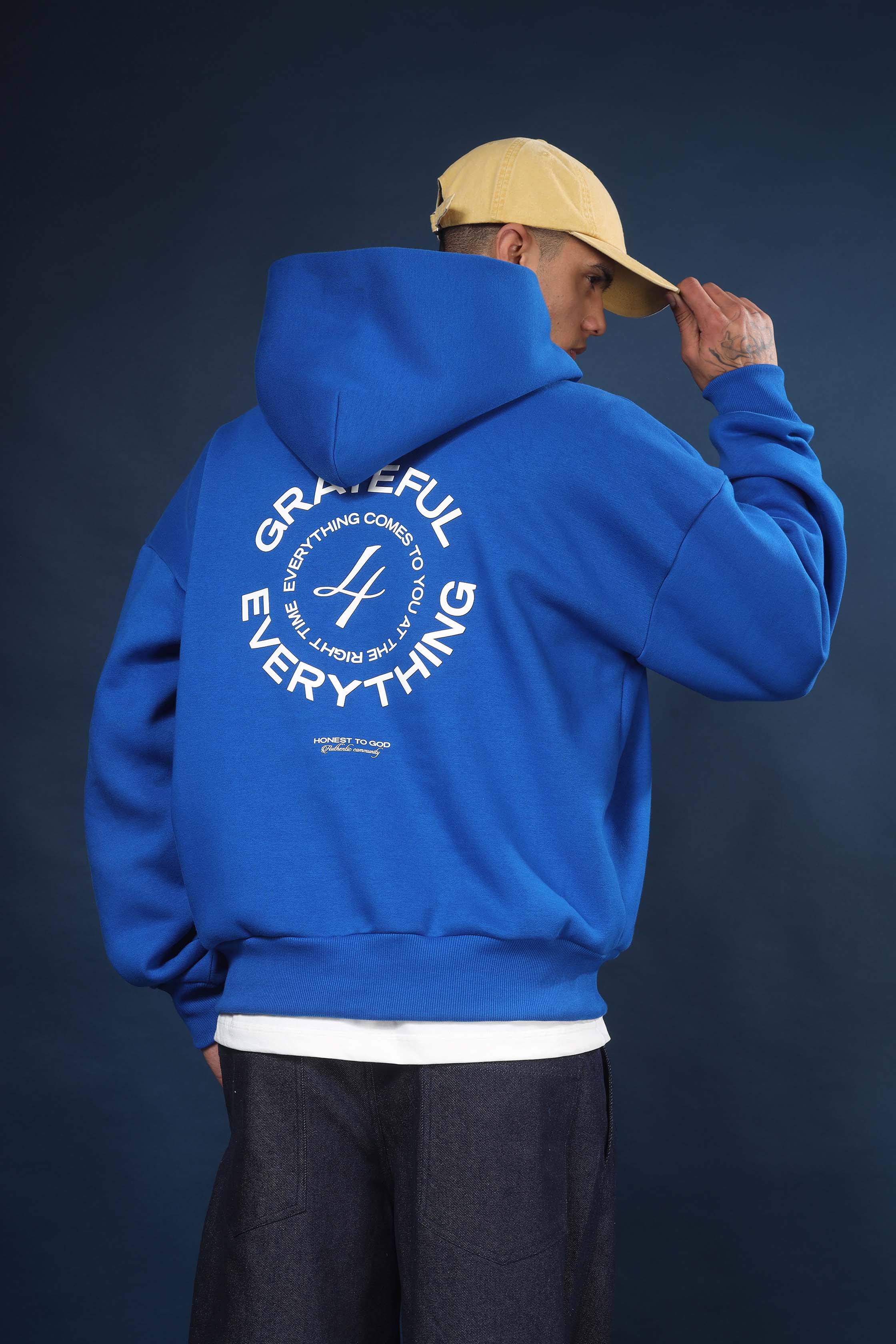 Side view of Honest to God Cobalt Blue hoodie highlighting the dropped shoulder and boxy cut.